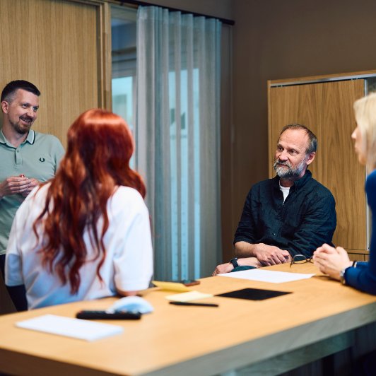 People sitting around a table and talking
