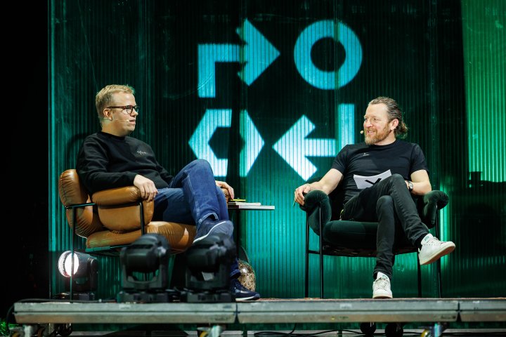 Two people sitting on stage