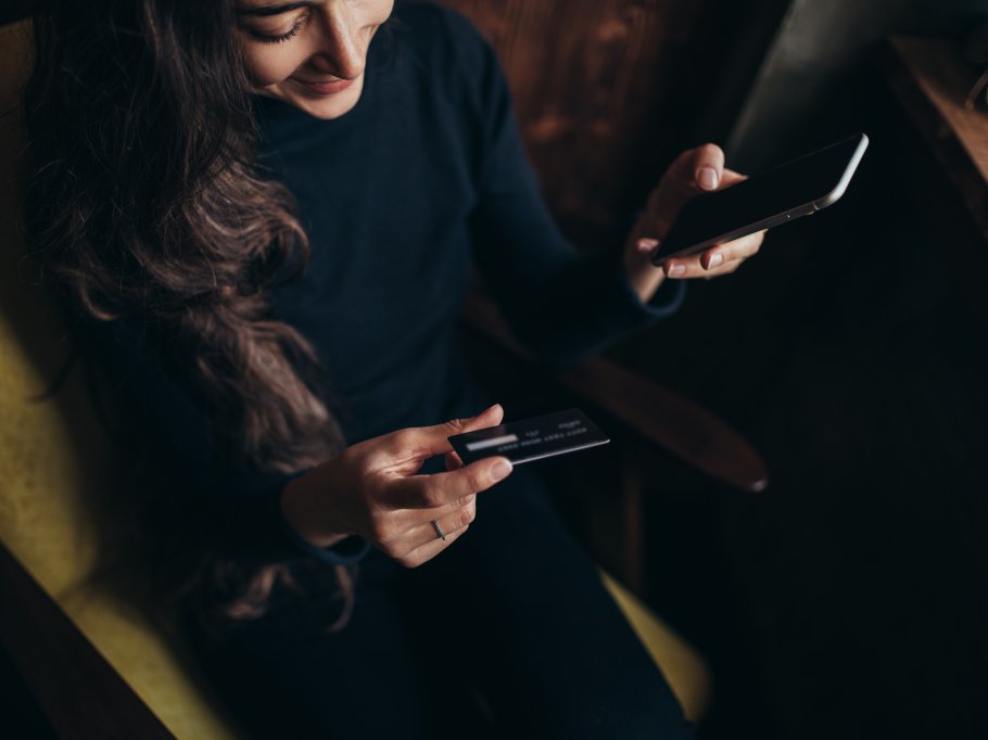 young-woman-shopping-online-using-her-smartphone-a-2023-11-27-05-15-25-utc