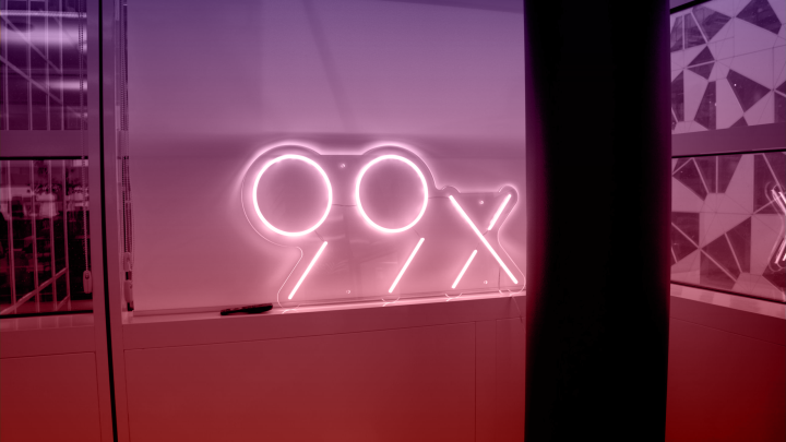 99x logo in the window sill at the office